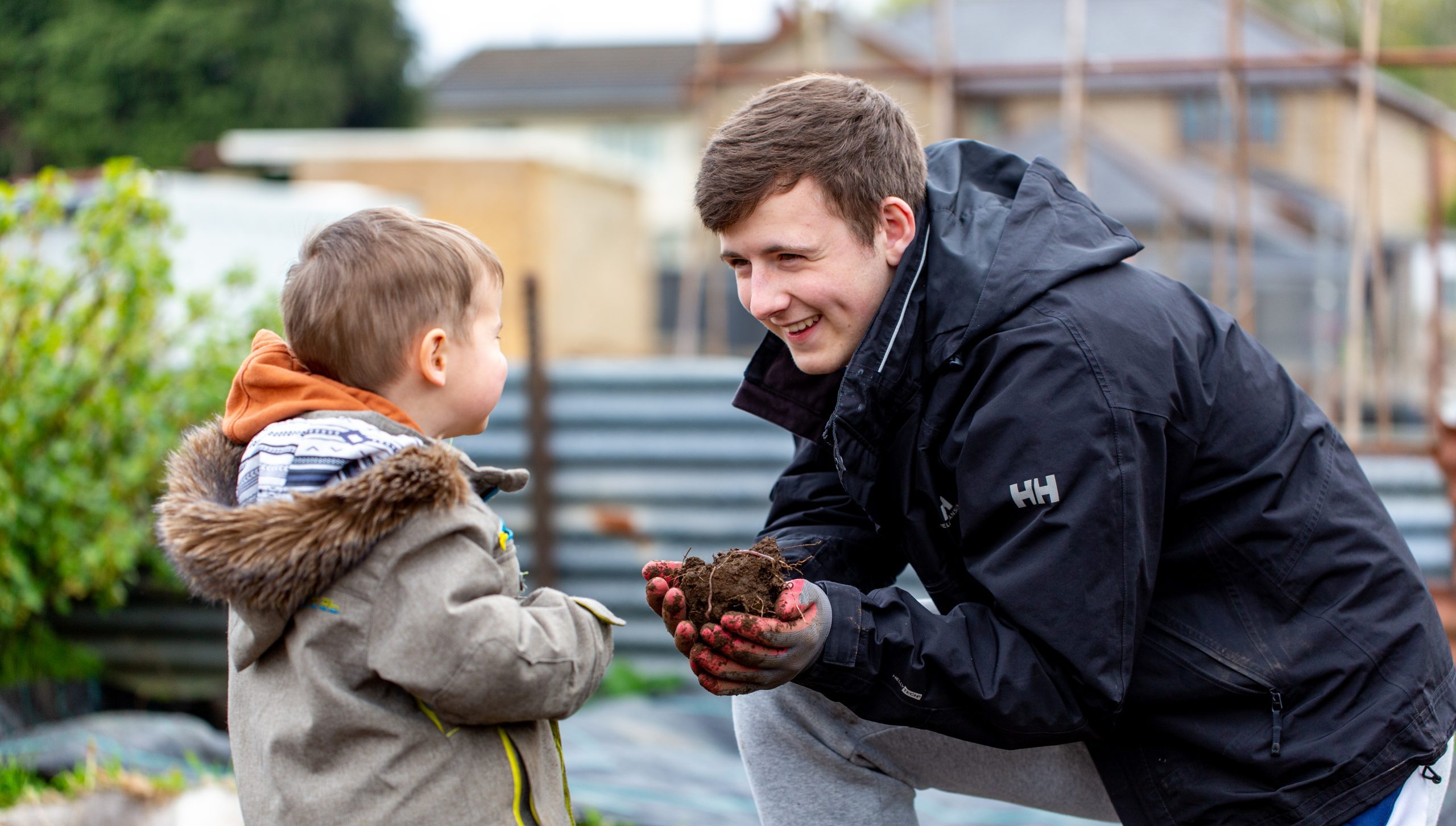 A young man and a child in the garden